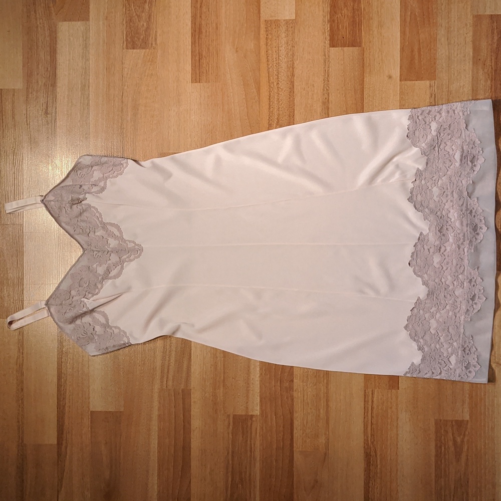 Vintage light pink dress slip with lace trim on bodice and hem by Dorsay